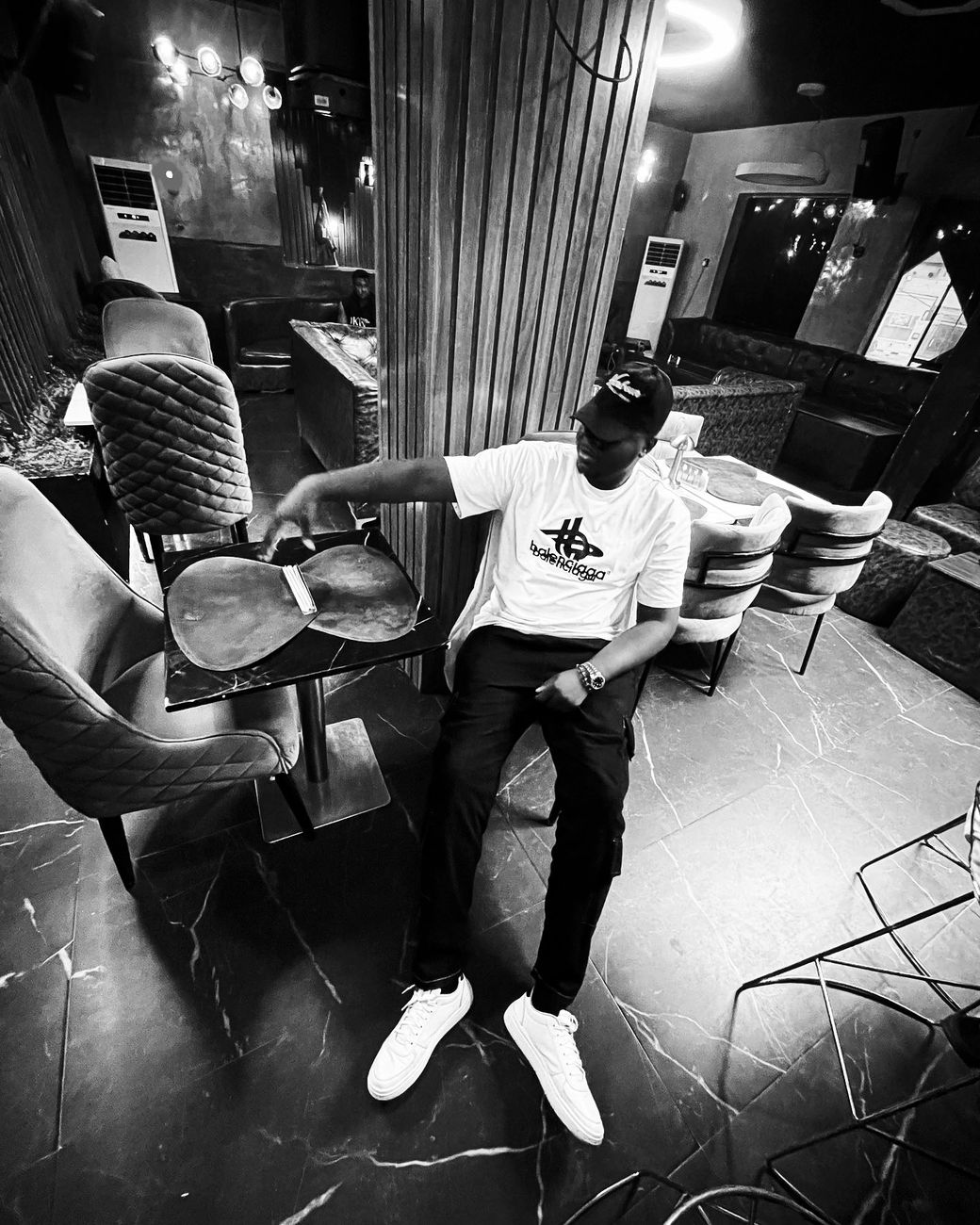 Harold seated in a lounge chair at Black30 restaurant