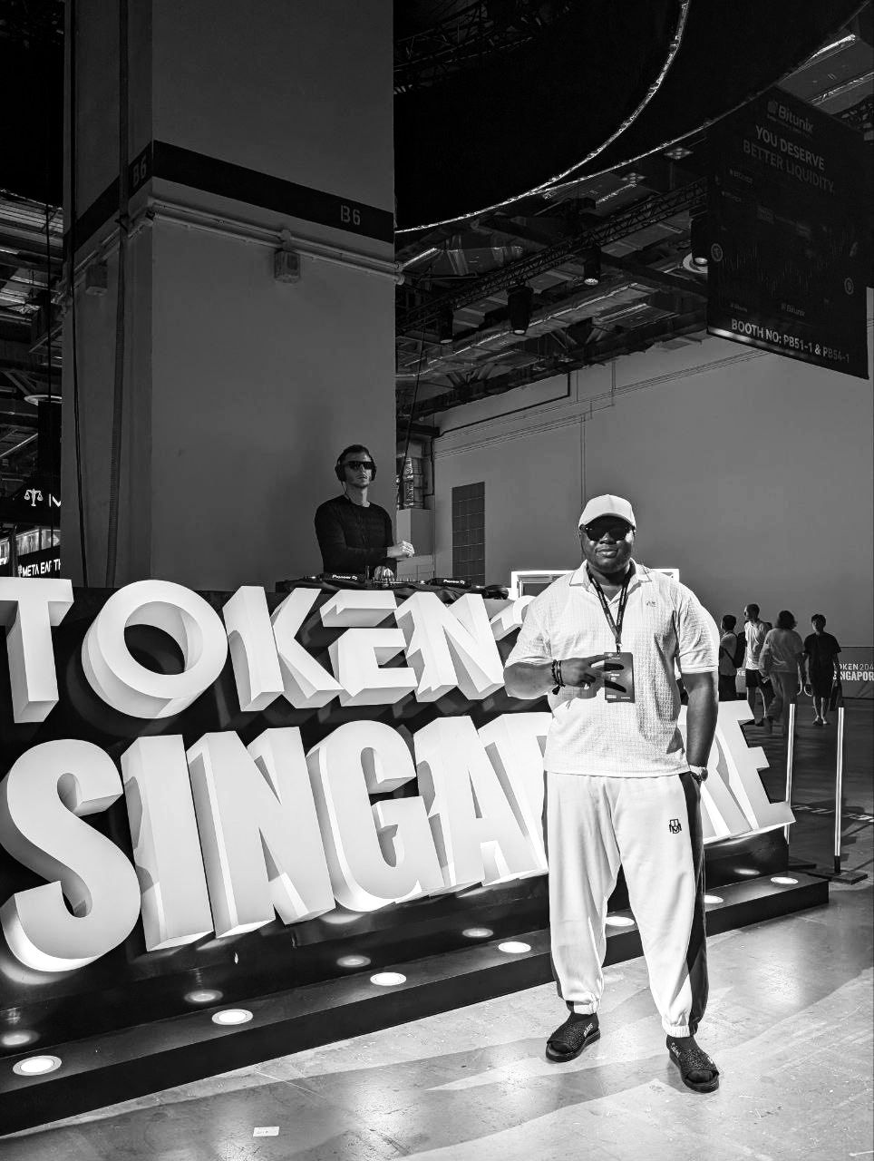 Harold standing in front of the giant TOKEN SINGAPORE letters